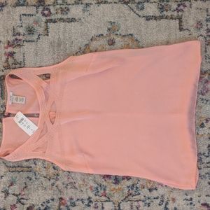 Cache top. never been worn with tags. Size small